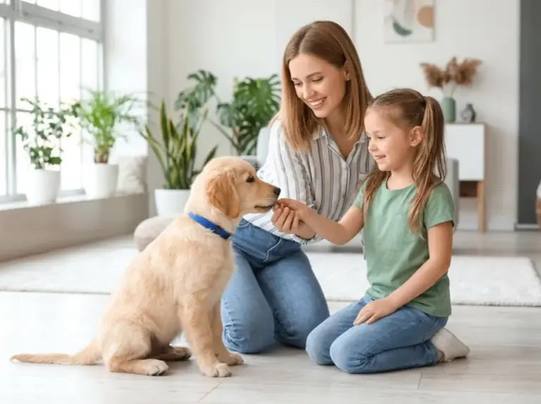 a mom teaches her young child how to interact properly and safely with home dog